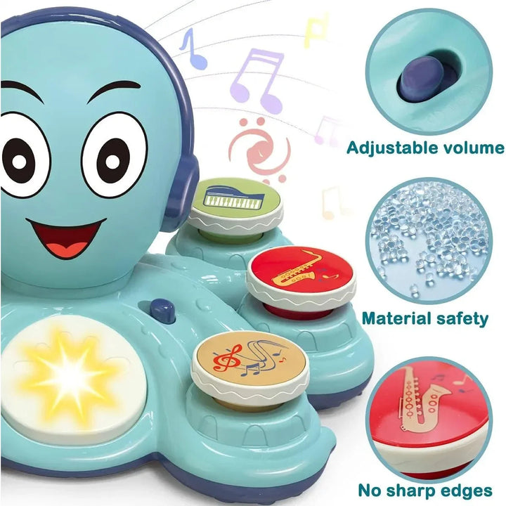 Close-up of the blue octopus music toy with its volume control and glowing center button.