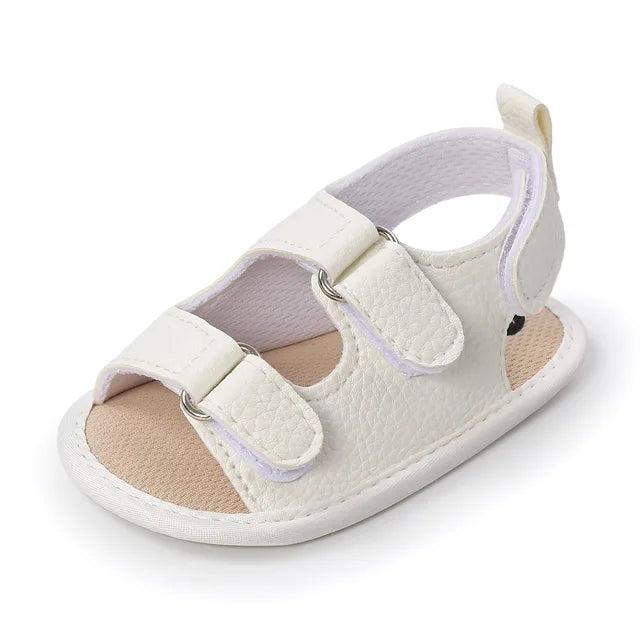 Off-white open-toe baby sandal with two hook-and-loop straps