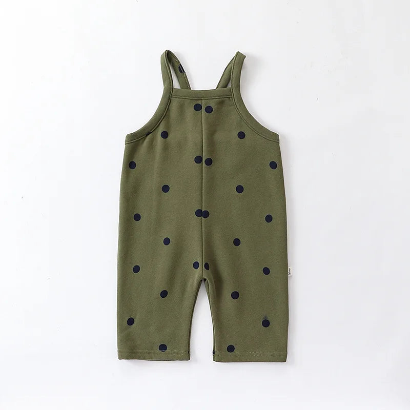 Olive green baby overalls with dark dots and sleeveless shoulder straps