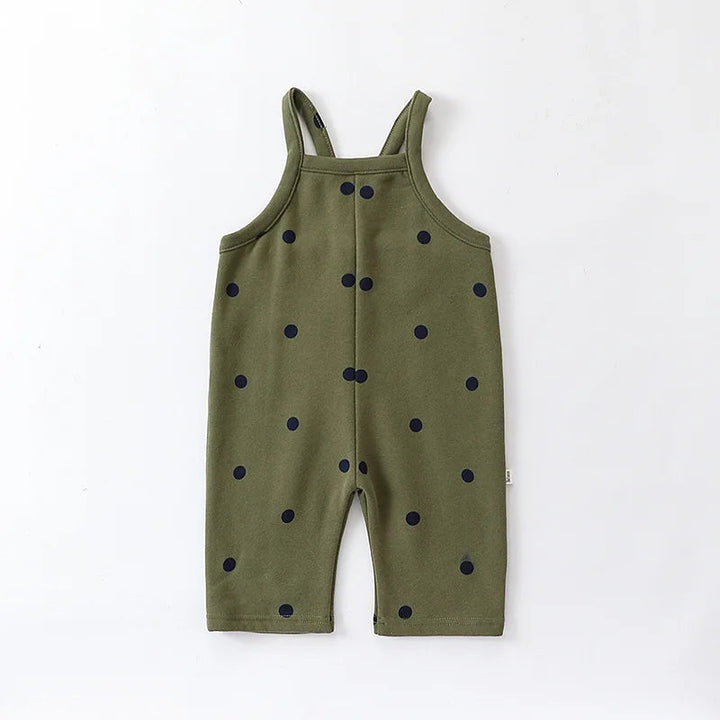 Olive green baby overalls with dark dots and sleeveless shoulder straps