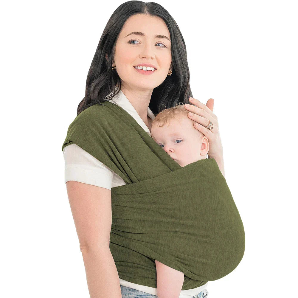Parent carrying a baby in an olive-green wrap