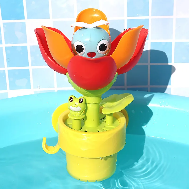 Open red and orange flower bath toy in a yellow pot against blue tiles