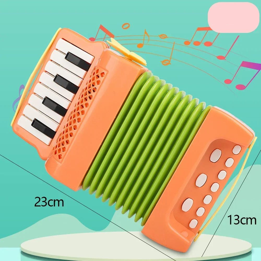 Orange toy accordion with green bellows and 23 by 13 cm measurements