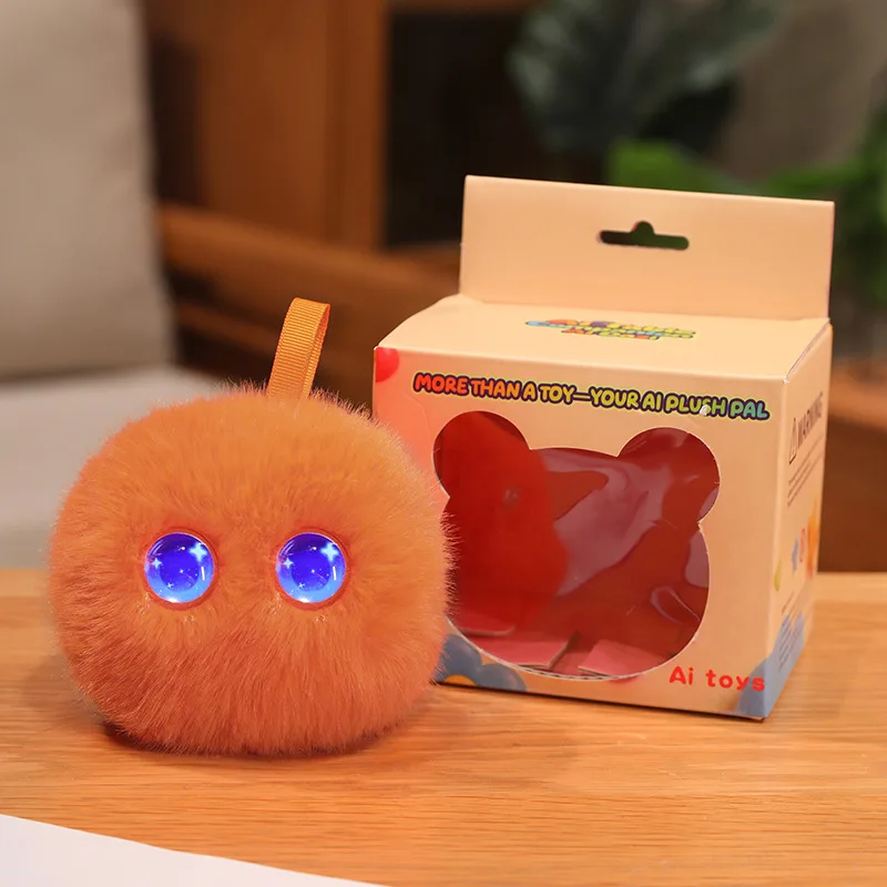 Orange AI plush toy with blue eyes and a hanging loop beside its box