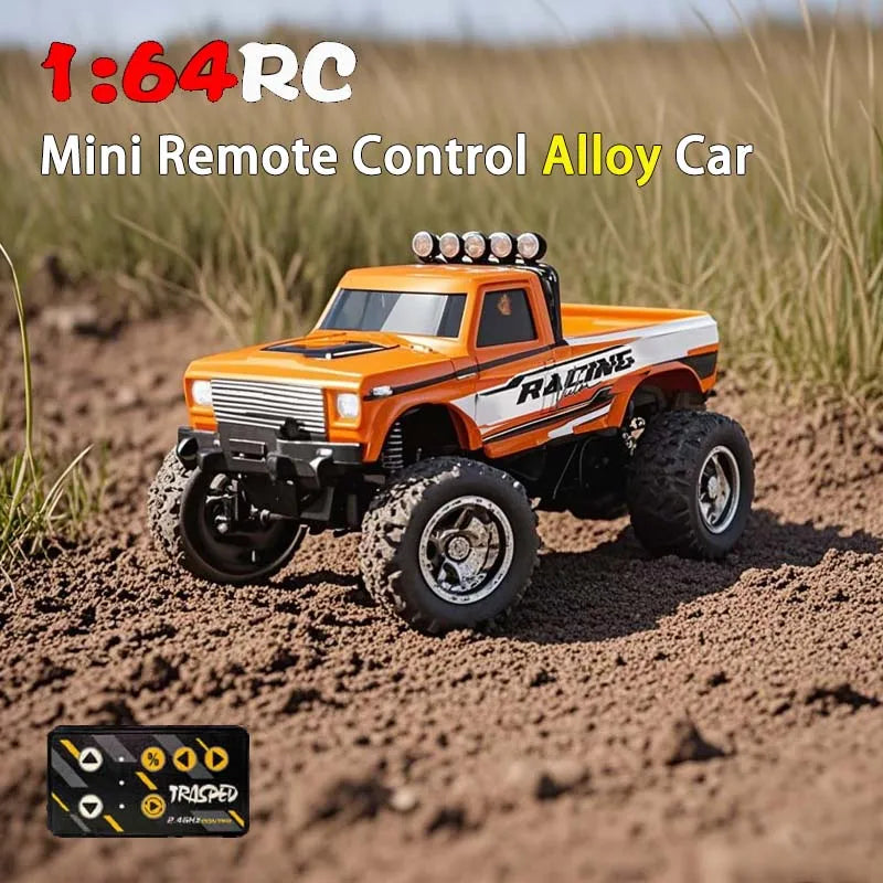 Orange 1:64-scale RC pickup truck on dirt with a compact remote shown below.