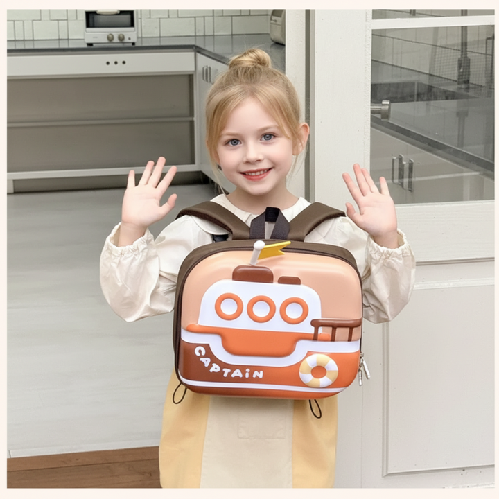 Child showing the orange boat backpack with its shoulder straps visible