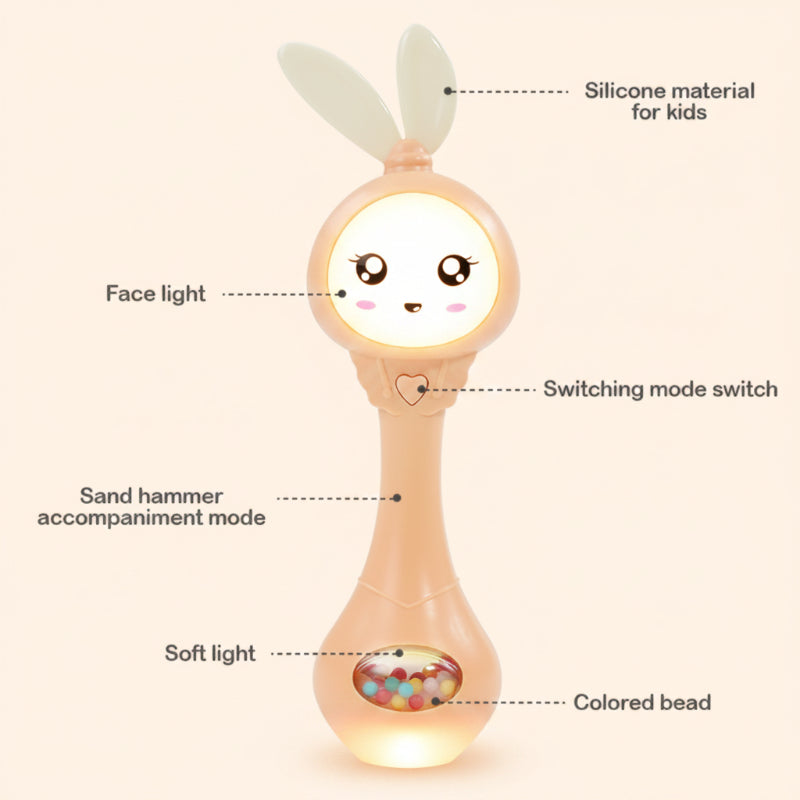 Orange bunny rattle showing silicone ears, a mode button, light-up face and glowing base