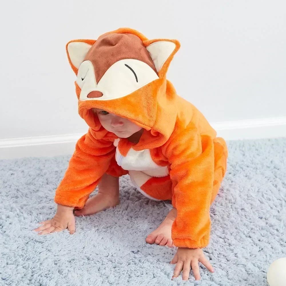 Baby crawling in an orange fox onesie with a white belly and fox-face hood