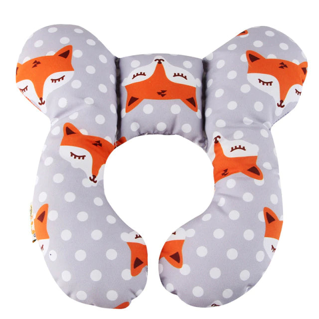 Gray butterfly-shaped pillow with orange fox faces and a split lower edge