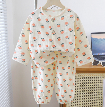 Cream pajama set with orange fruit motifs and matching pants