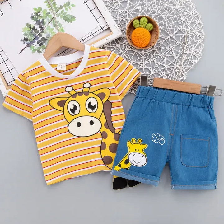 Orange striped giraffe T-shirt beside blue shorts with a pocket and giraffe detail