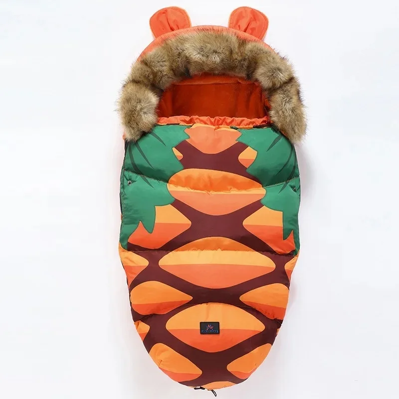 Orange and green patterned stroller footmuff with faux fur trim and orange ears