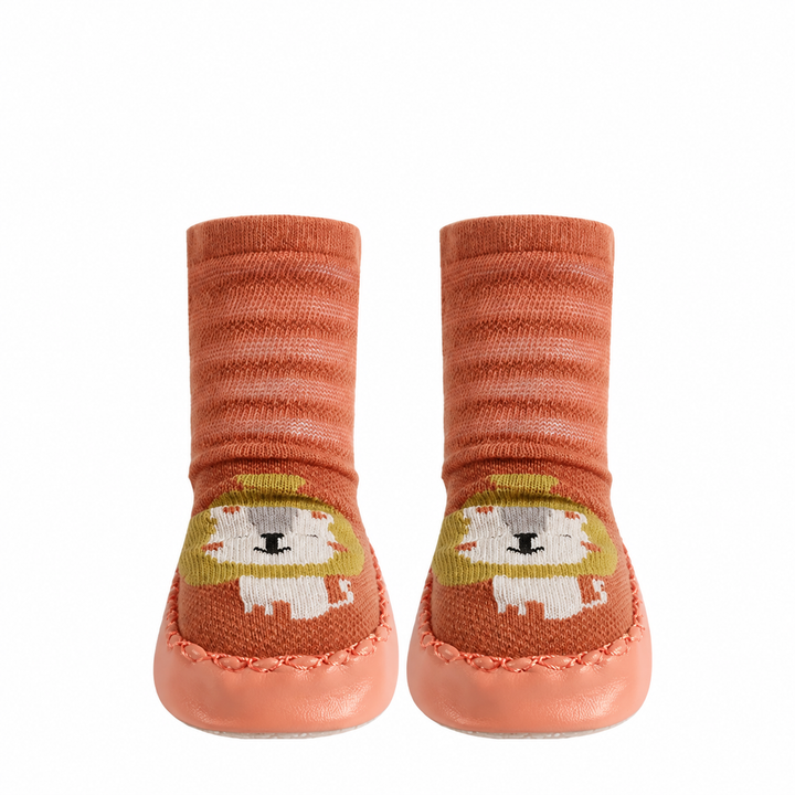 Orange striped sock shoes with lion faces, shown as a pair