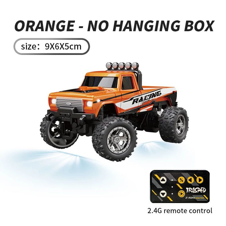 Orange mini RC truck and compact remote, with dimensions shown as 9 x 6 x 5 cm.