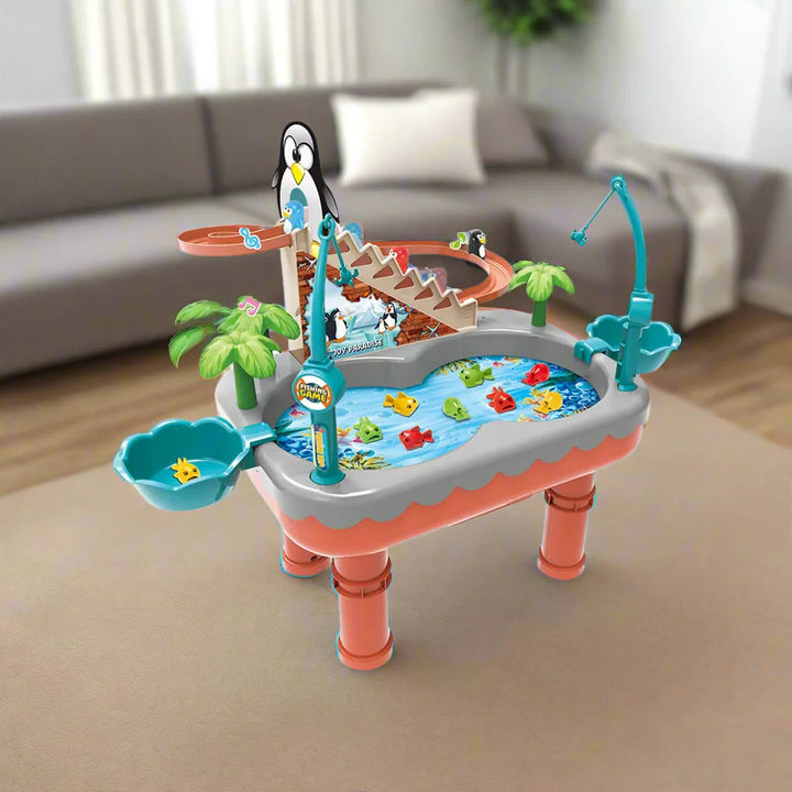 Orange penguin fishing table with a slide, colorful fish, and two side bowls