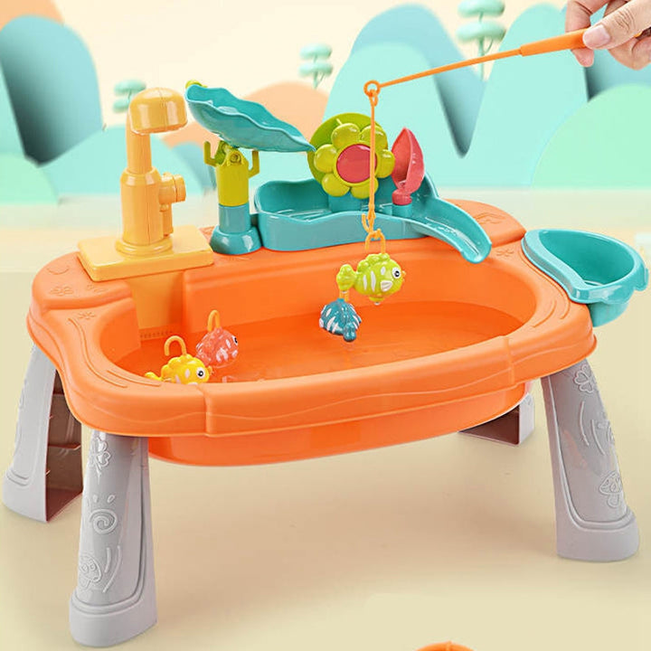 Fishing rod lifting a toy fish from the orange play sink beneath the flower water wheel