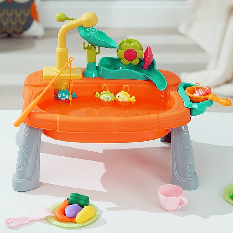 Orange play sink with floating toy fish, a fishing rod and pretend kitchen accessories
