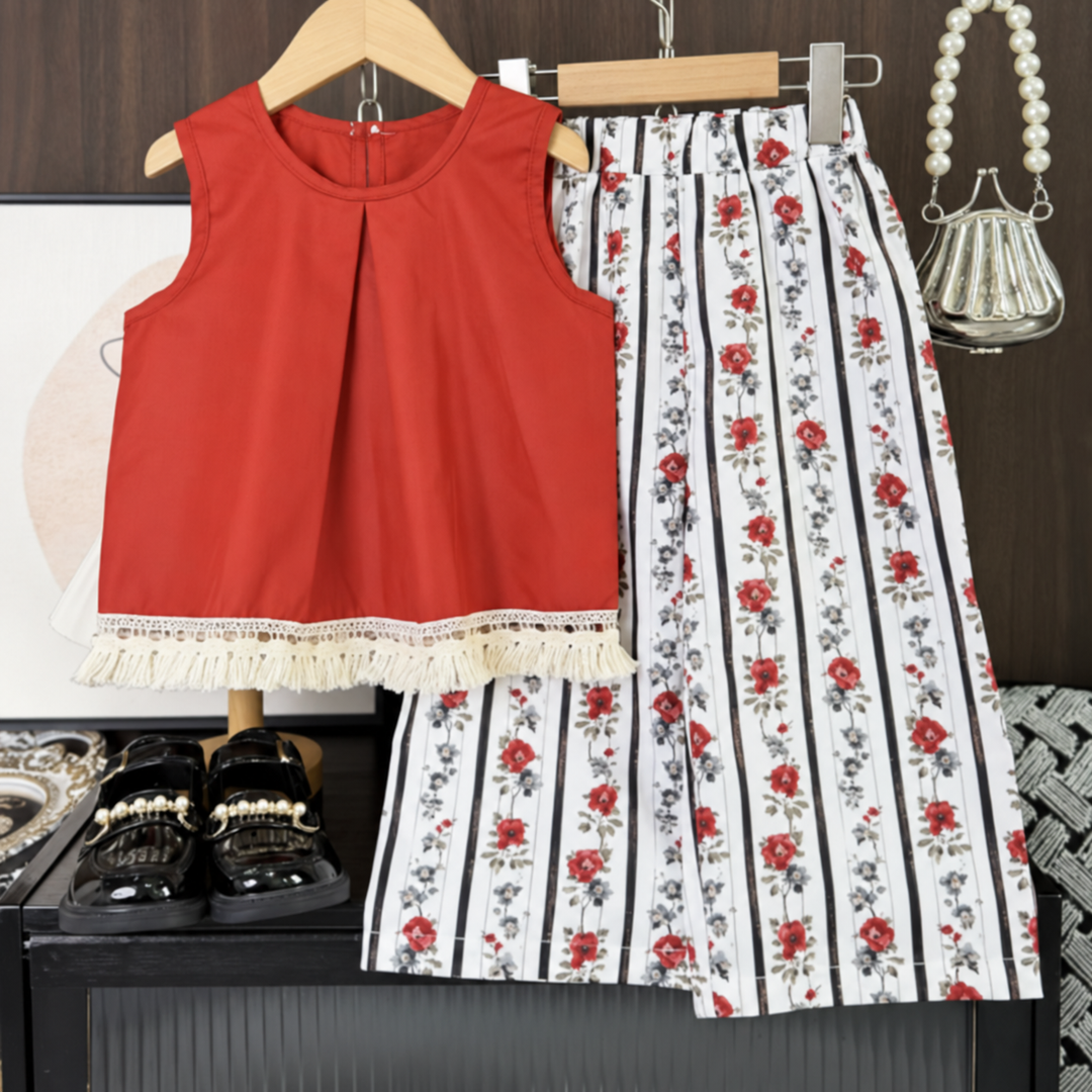 Orange-red sleeveless top with a fringed hem and floral striped pants