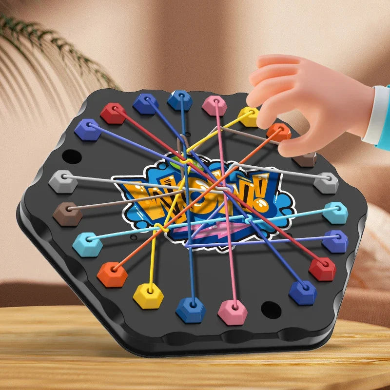 Hand lifting an orange rope connector on a black hexagonal puzzle board.
