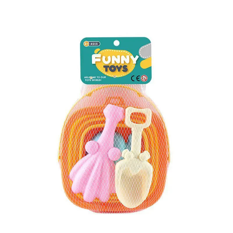 Orange collapsible bucket with a pink rake and cream shovel packed in a mesh bag.