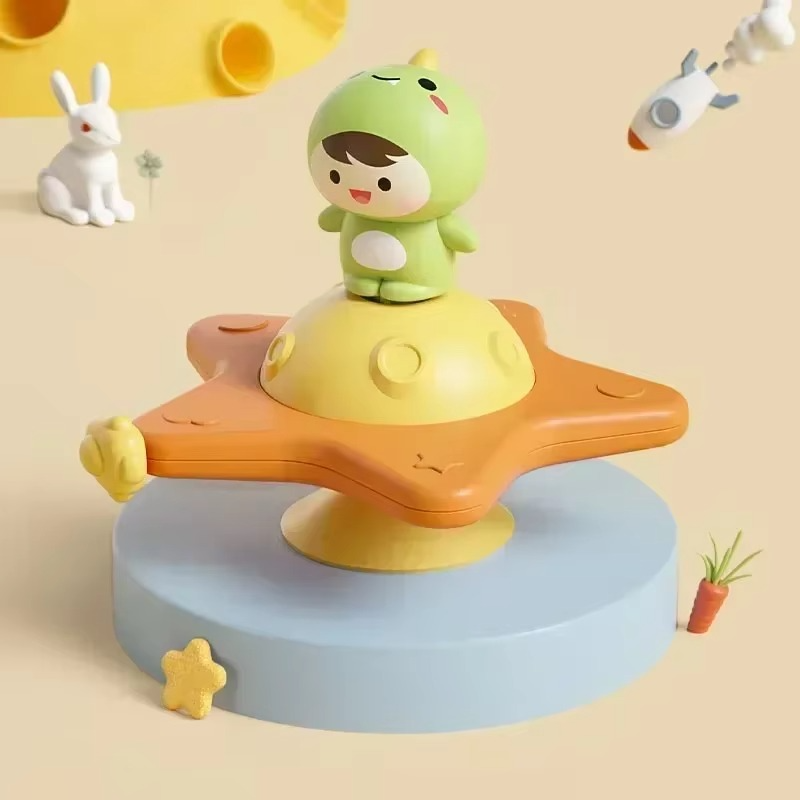 Dinosaur character on an orange star-shaped spinner with a yellow center
