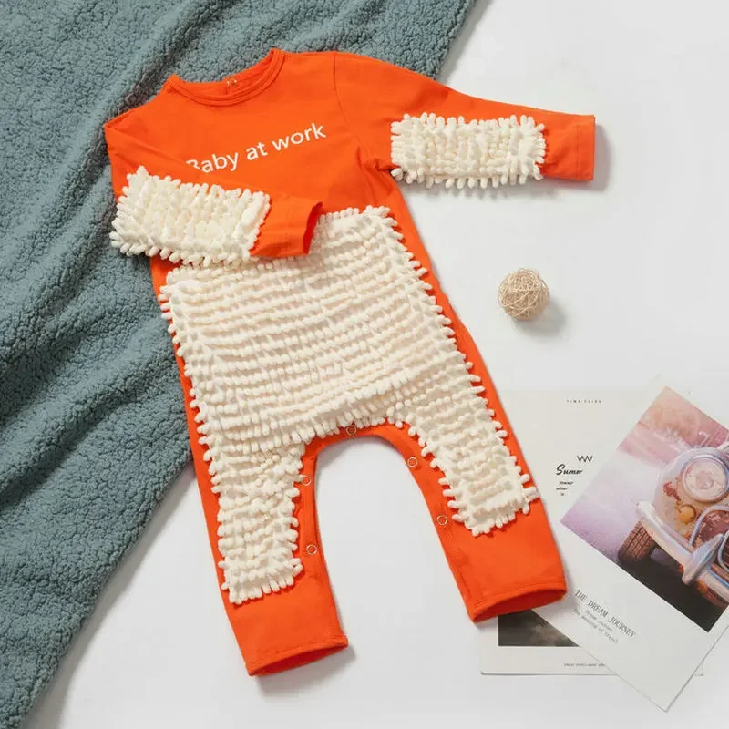 Orange baby jumpsuit with white cleaning fibers on the front and sleeves