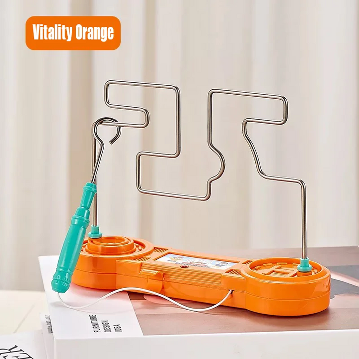 Orange wire maze game with a green loop wand and white connecting cord