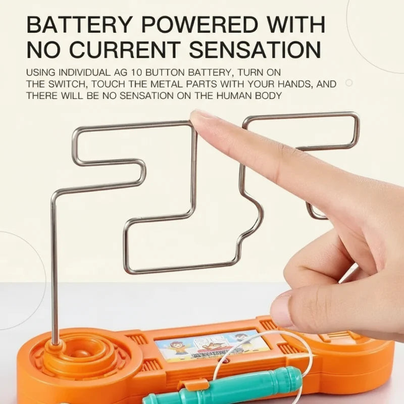 Hand touching the metal track on an orange tabletop wire maze game