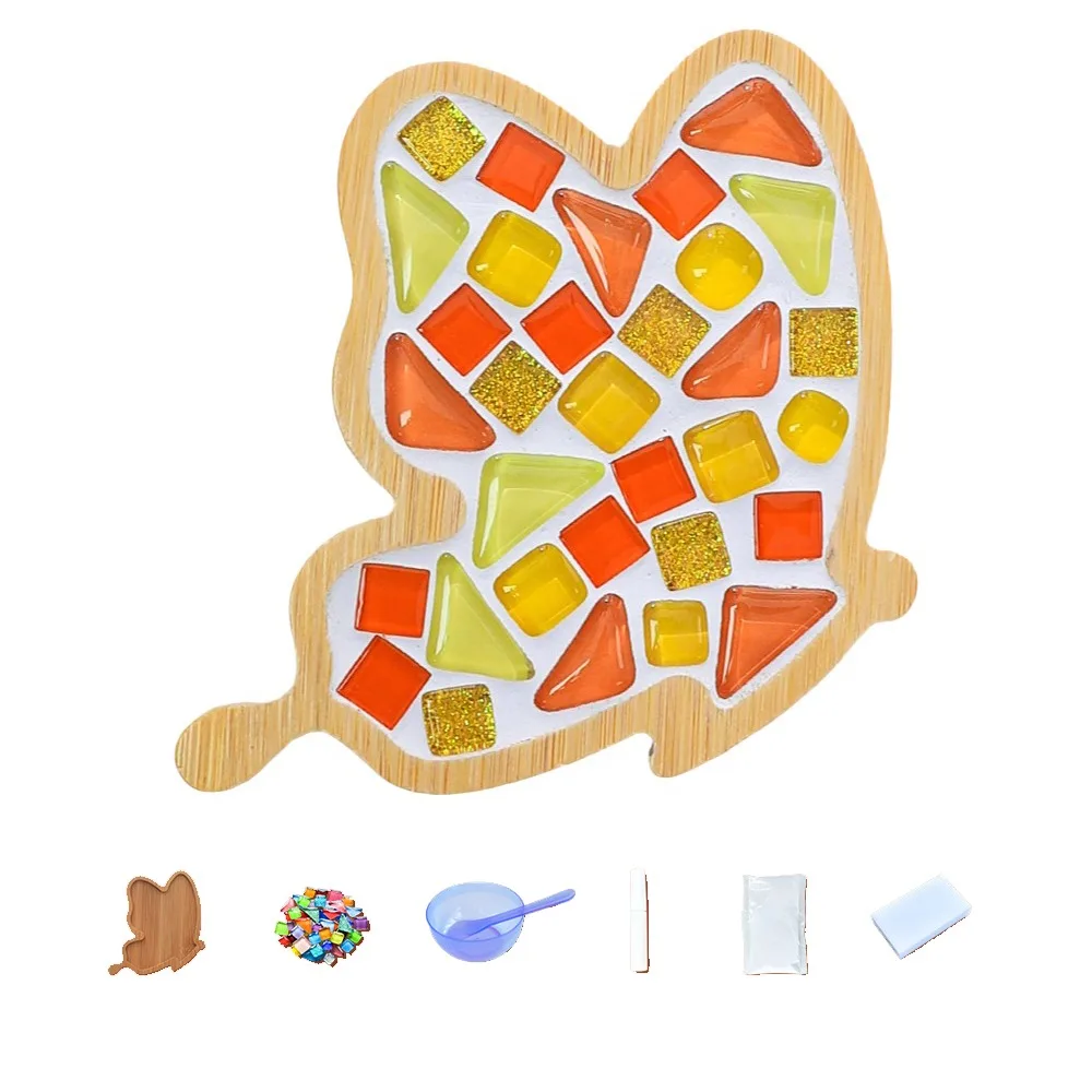 Tall bamboo mosaic coaster with orange, yellow and green tiles, shown with crafting supplies