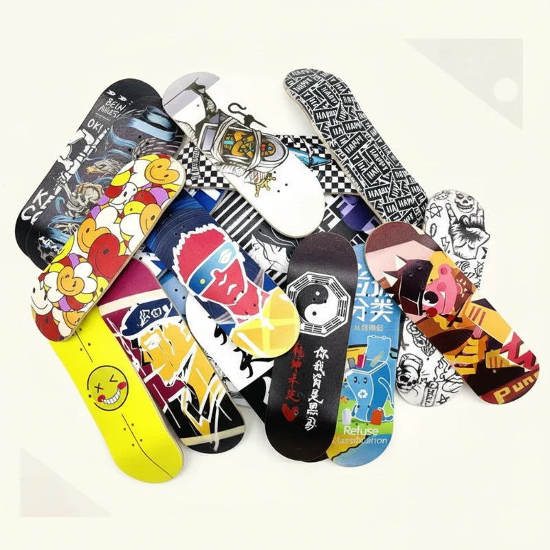Overlapping fingerboard decks with colorful cartoon and black-and-white designs.