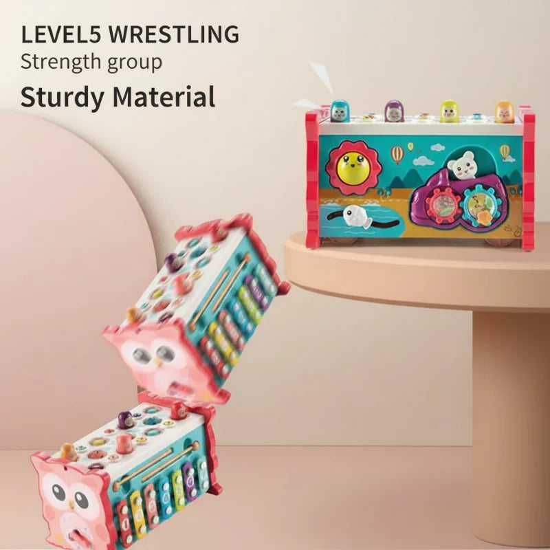 Pink and turquoise owl activity toys with plastic bodies, hammering pegs, and gear panels