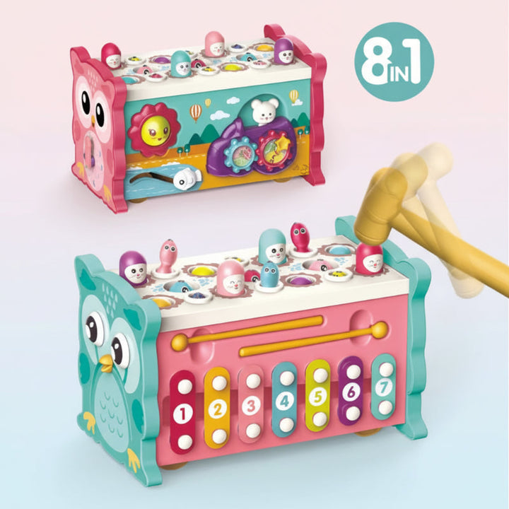 Pink and turquoise owl activity toys with hammering pegs, gears, and a numbered xylophone