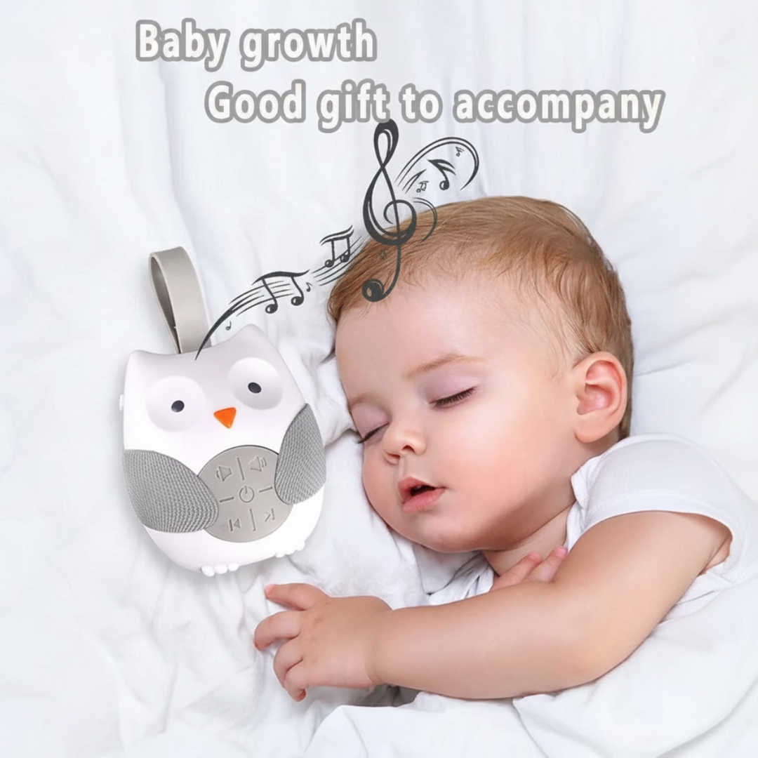Owl musical night light shown next to a sleeping baby with decorative music notes.