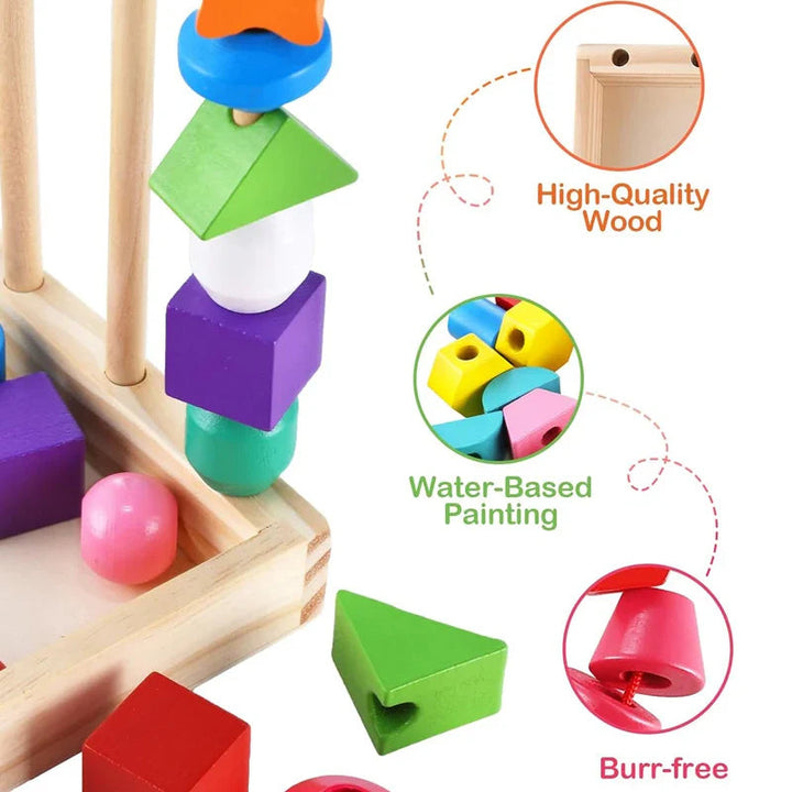 Close-up of painted wooden shapes, center holes, and the corner of the wooden box