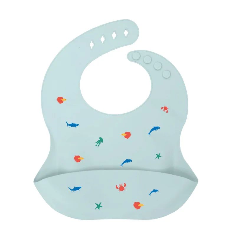 Pale blue silicone baby bib with fish print and an adjustable neck closure