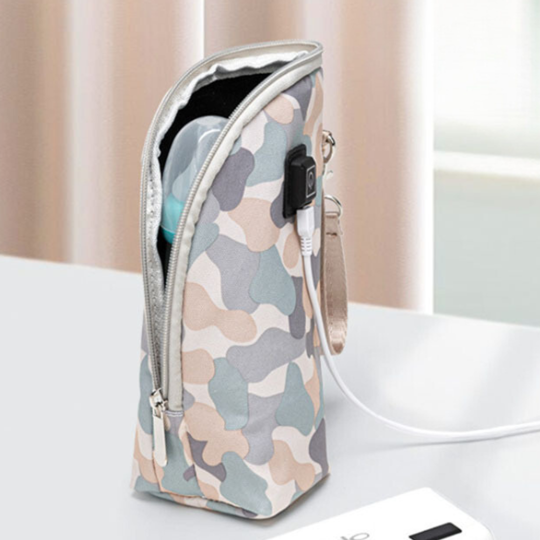 Pale camouflage zippered bottle warmer with wrist strap and USB cable attached.