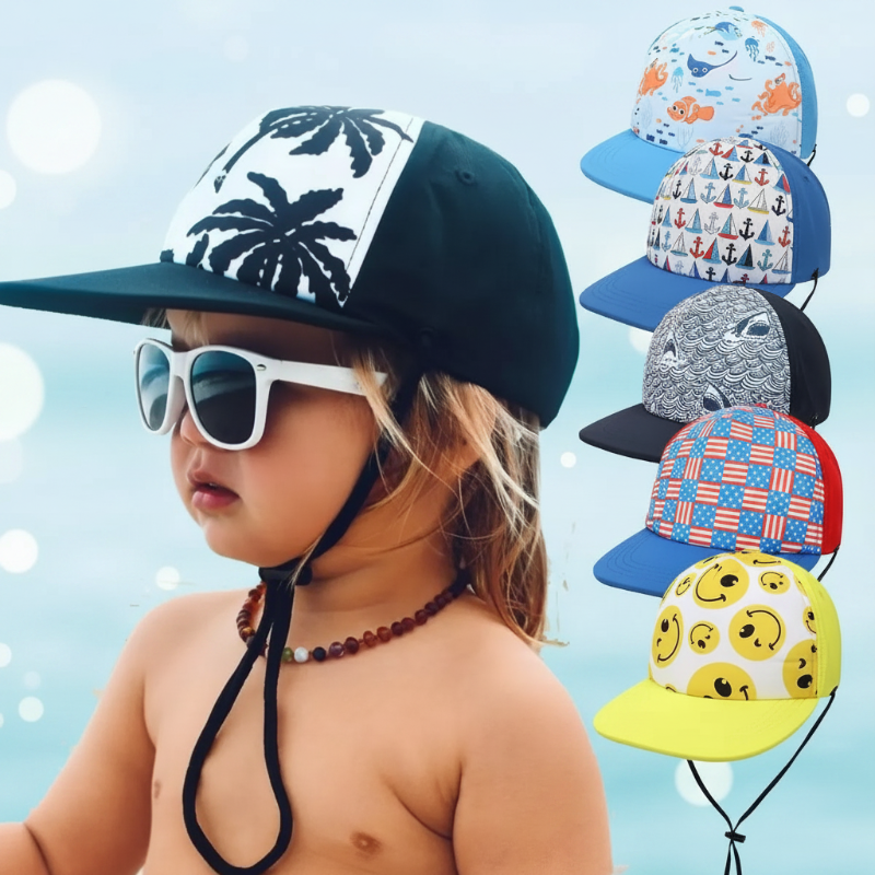 Child wearing a black palm-print cap beside a selection of colorful kids&