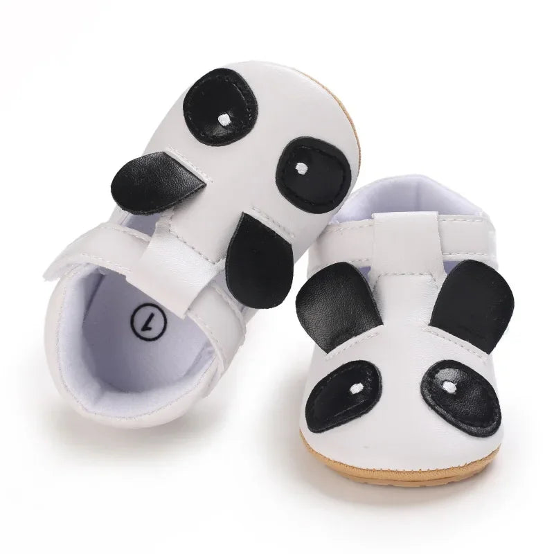 White panda-face baby shoes with black ears and eye patches