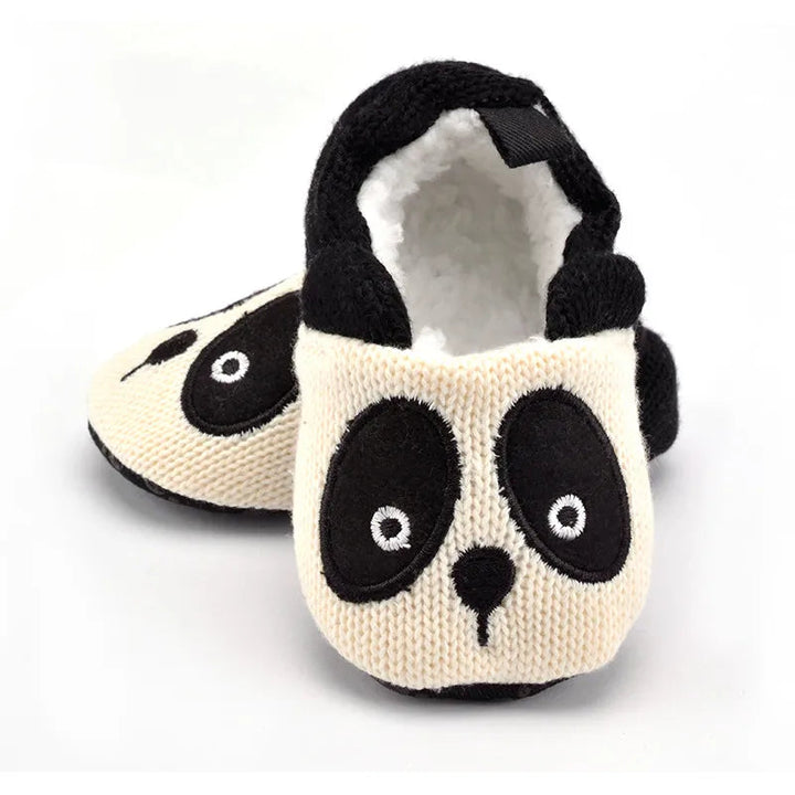 Panda baby slippers showing the embroidered face, rounded ears and fluffy interior