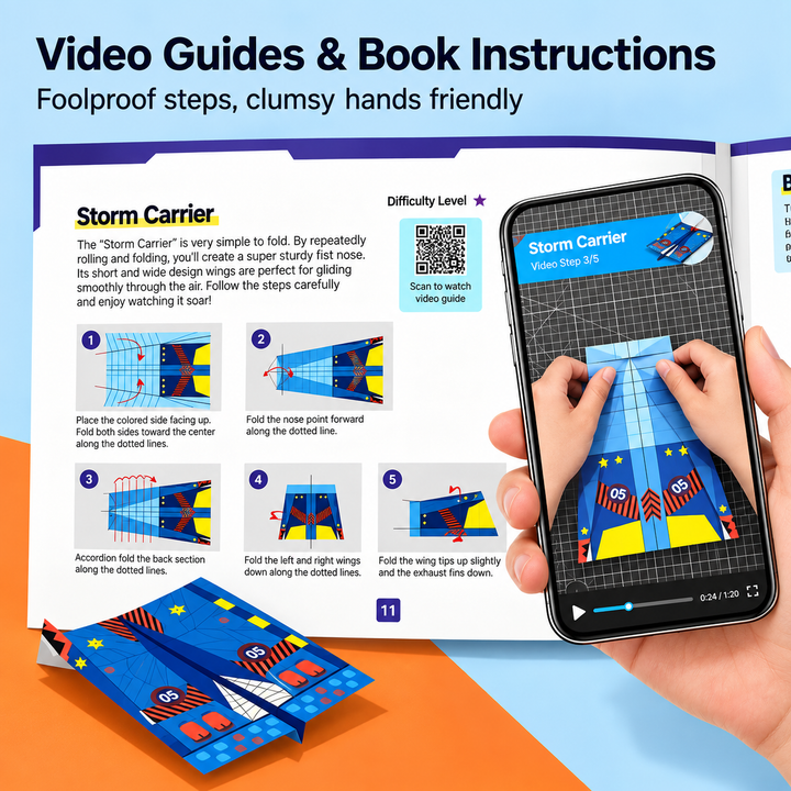 Open folding instruction book beside a phone displaying a paper airplane video guide