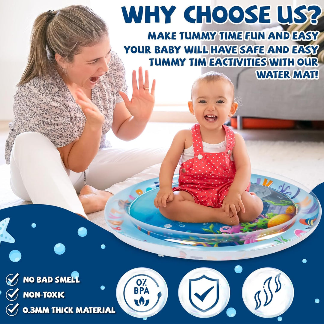 Parent sitting beside a baby playing on a round sea-themed water mat