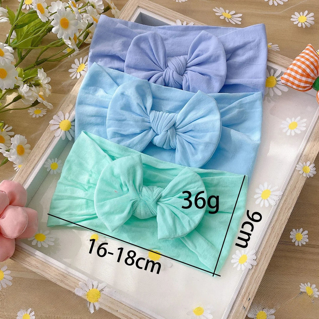 Mint, light blue, and lavender bow headbands with width and height measurements