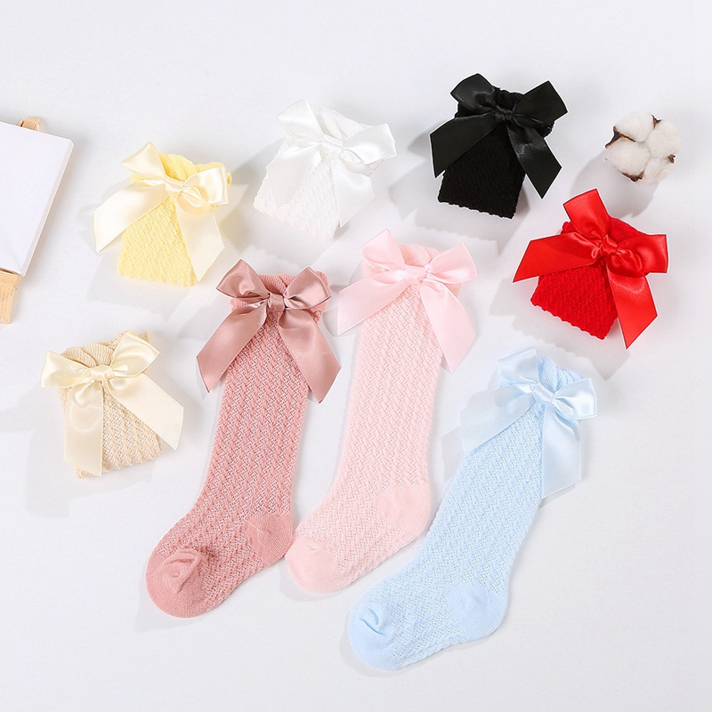 Pastel and bright knee-high socks with pointelle knit and large satin bows