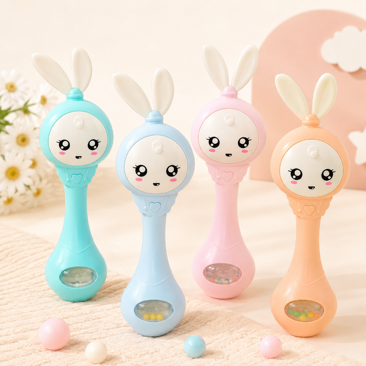 Four bunny baby rattles in green, blue, pink and orange with clear bead compartments