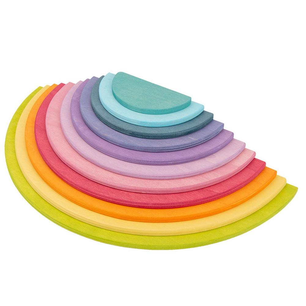 Pastel wooden semicircle discs layered in a graduated stack