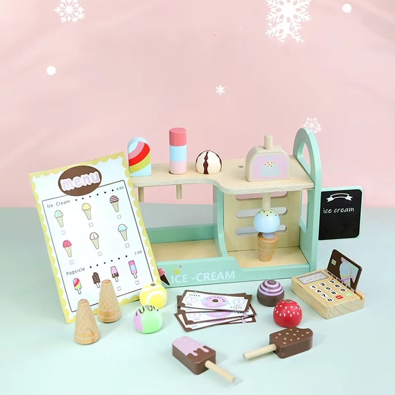 Pastel ice cream shop counter with toy treats, a menu, play money, and a cash register