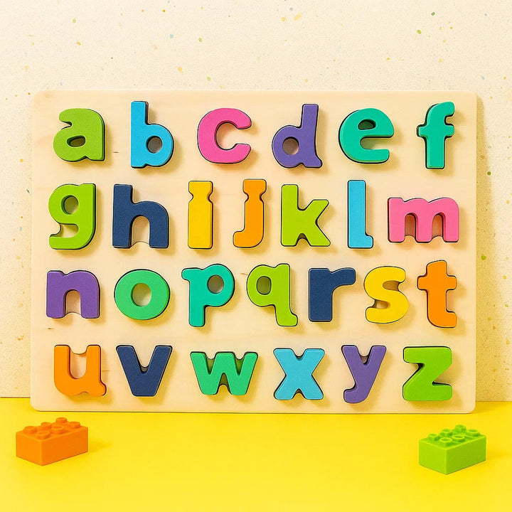 Pastel lowercase alphabet puzzle on a wooden board with a yellow backdrop
