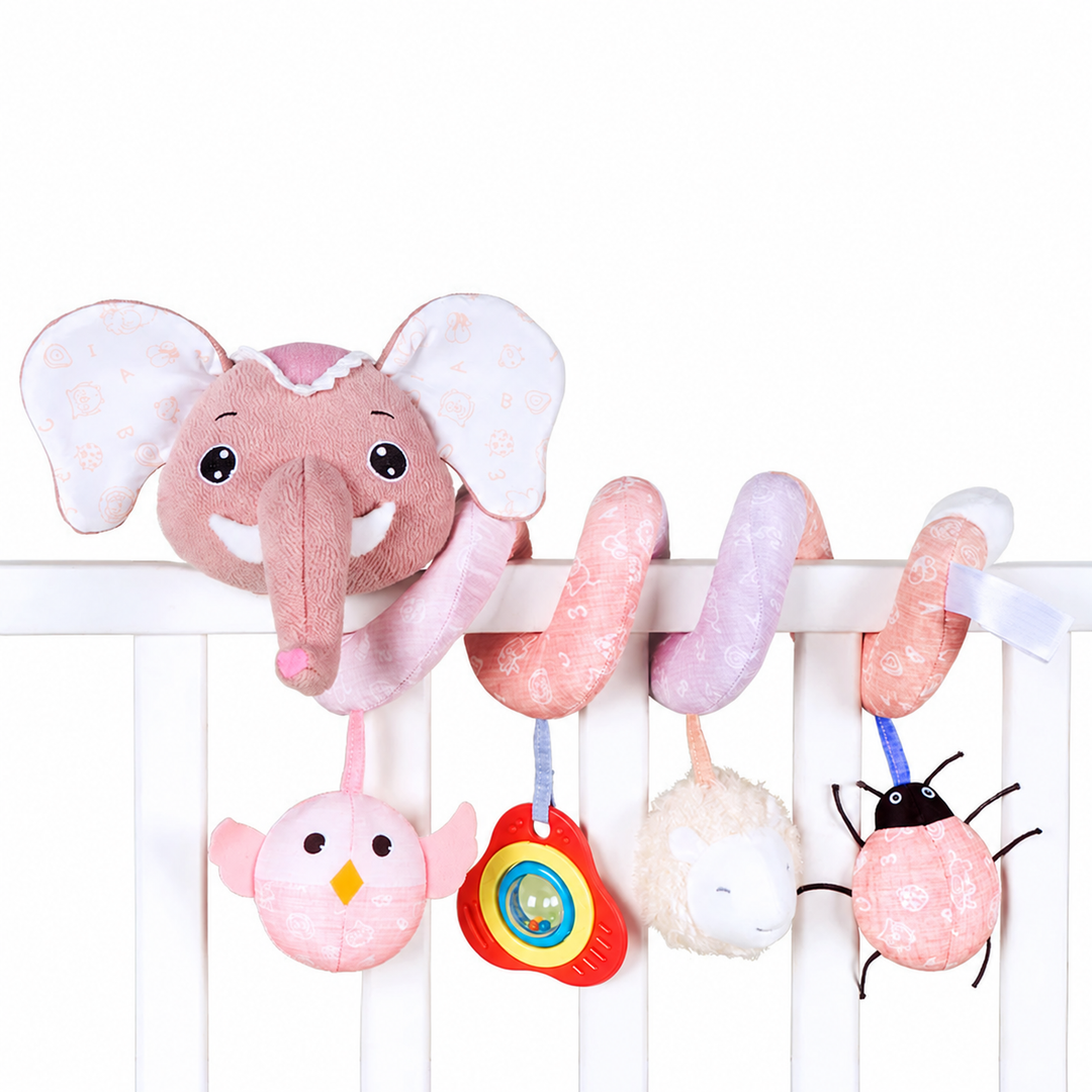 Pastel pink elephant spiral toy on a crib rail with a bird, colorful ring, fluffy shape, and bug.