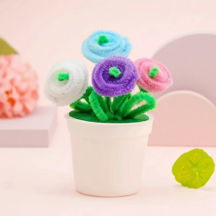 White, blue, purple, and pink spiral flowers with green centers in a white pot