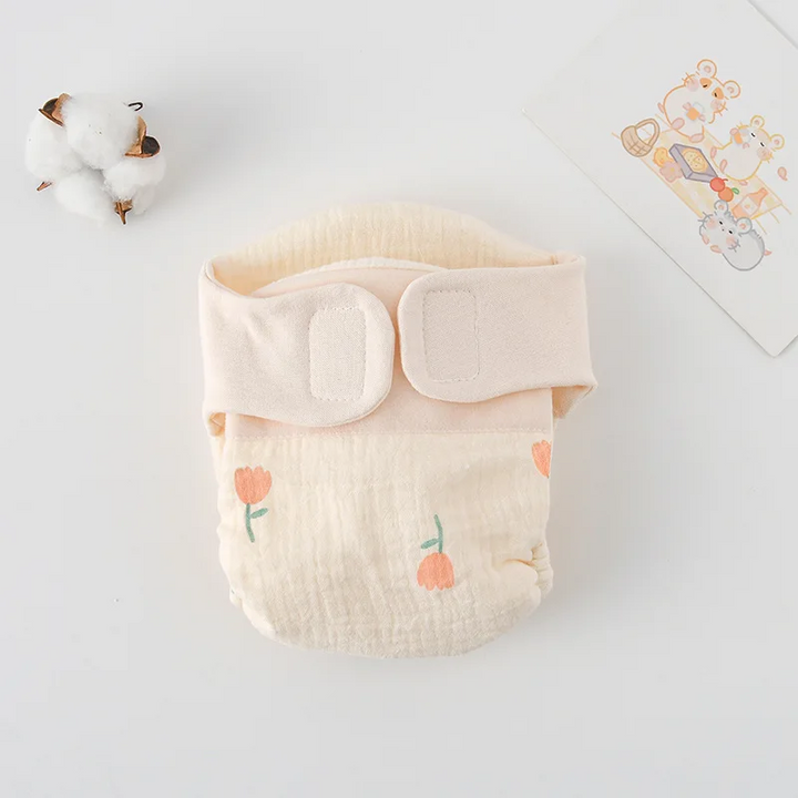 Cloth diaper with peach tulip prints and green stems